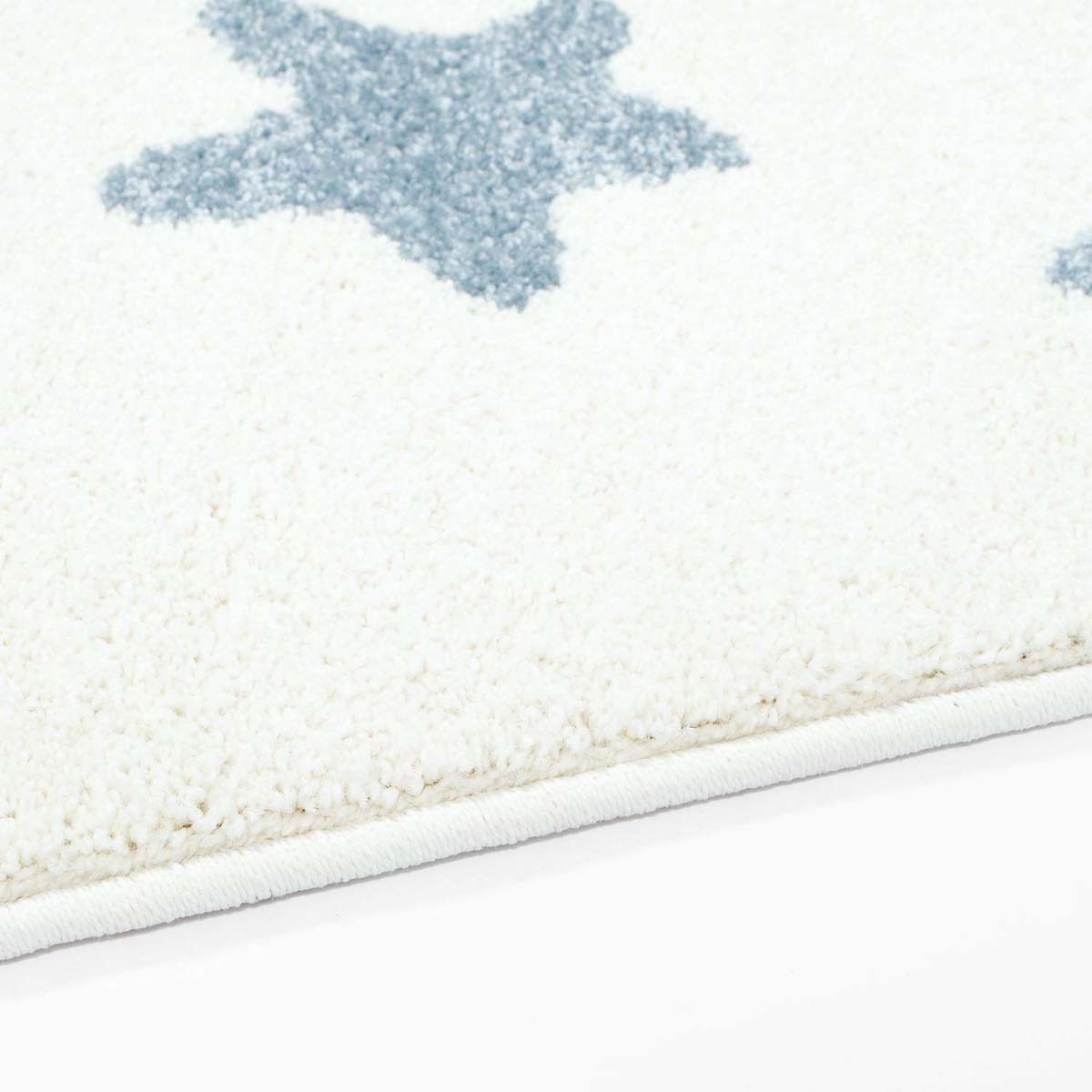Tappeto bambini con stelle - Lyra crema/blu - close up zijkant Tappeto bambini con stelle - Lyra crema/blu - close up zijkant