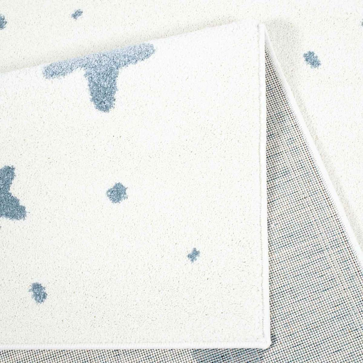 Tappeto bambini con stelle - Lyra crema/blu - close up vouw Tappeto bambini con stelle - Lyra crema/blu - close up vouw