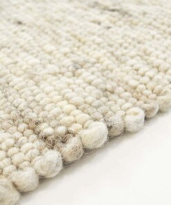 Tappeto in lana tessuto a mano Ylva - Beige - close up zijkant, thumbnail Tappeto in lana tessuto a mano Ylva - Beige - close up zijkant, thumbnail